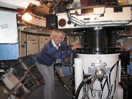Dr. Andrea K. Dupree, Harvard-Smithsonian Center for Astrophysics, at the cassegrain focus of the 4-m Mayall telescope of the National Optical Astronomy Observatories, Kitt Peak, AZ.