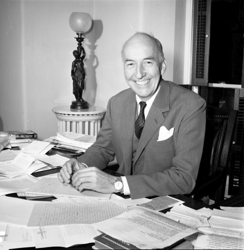 Secretary S. Dillon Ripley at desk.