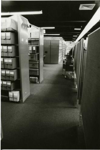 Smithsonian Institution Archives located on the second floor, northeast section, of the Arts and Industries Building. The stack range, storage, and cubicle work station area are shown here, 1979. Record Unit 95, Smithsonian Institution Archives, Neg. no. SIA2011-1487.