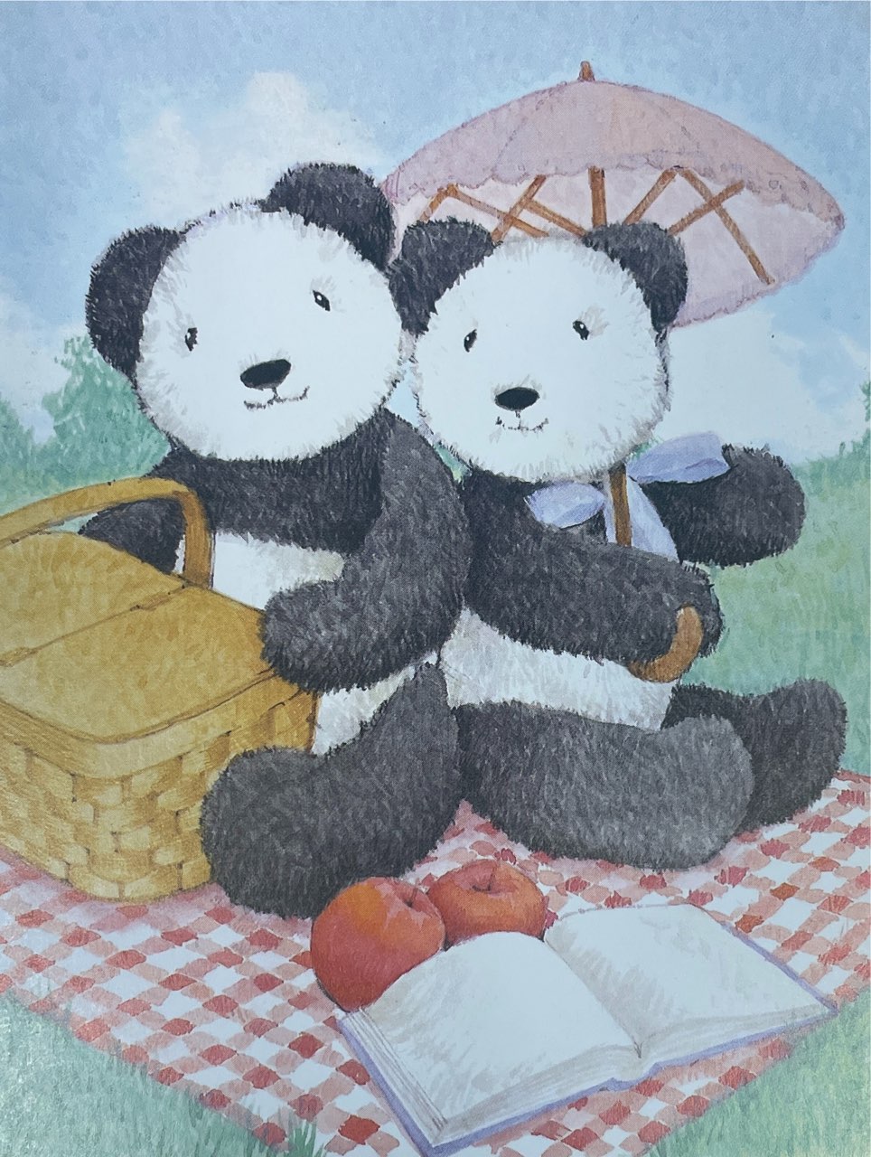 Cover of a card that has an illustration of two pandas having a picnic. 
