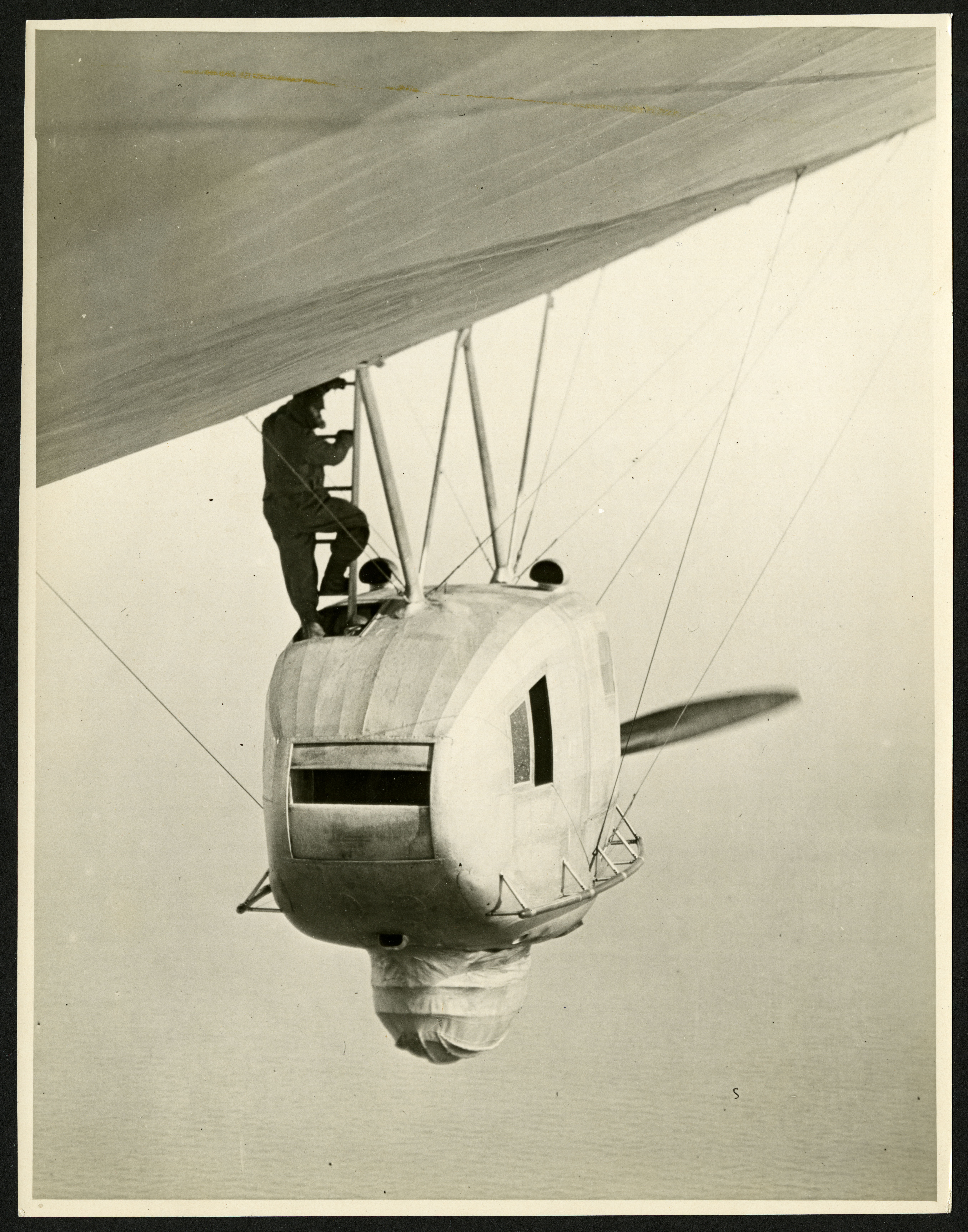 Photographer Walter Leroy Richardson heading into the observation basket of the dirigible.