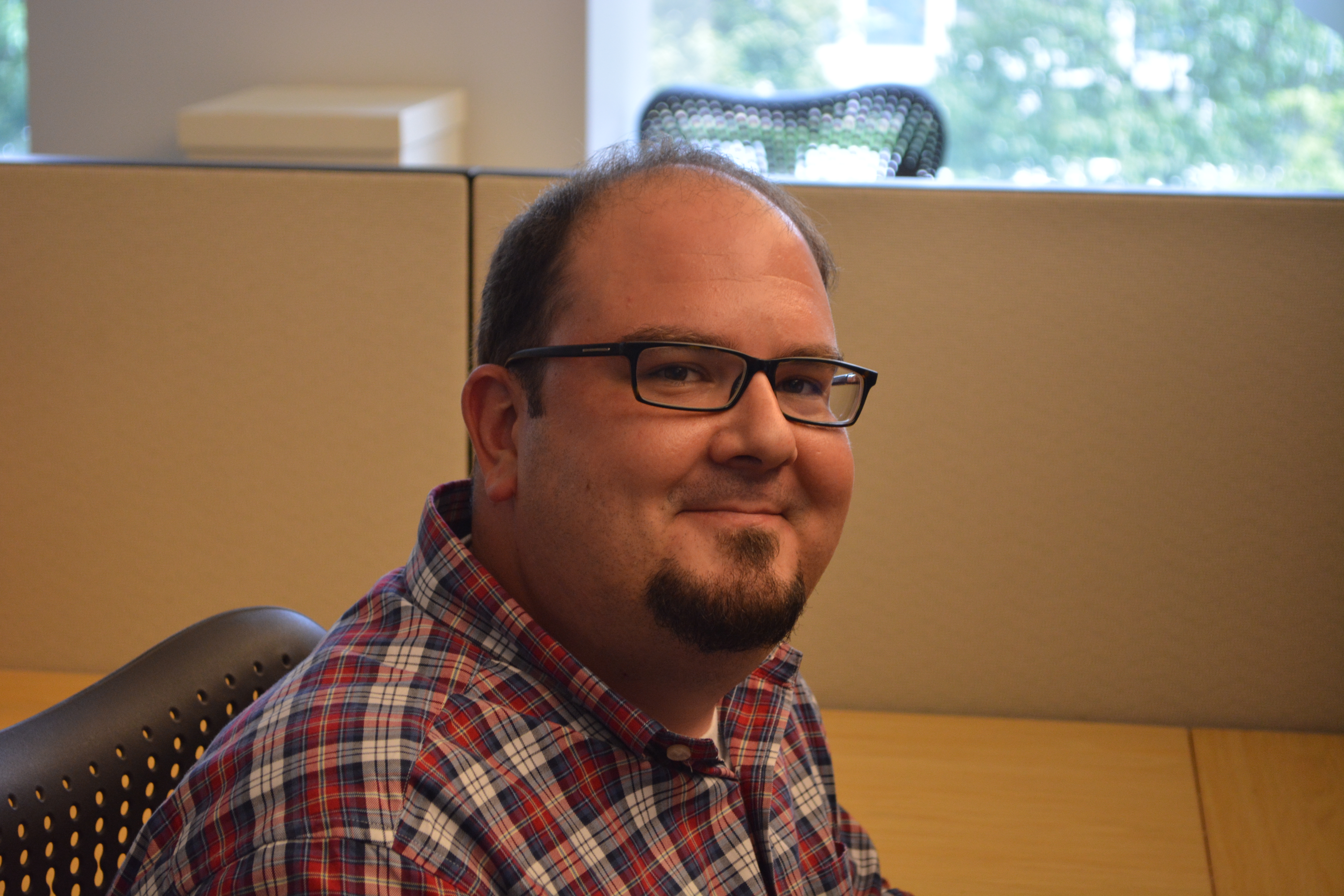 Patrick Milhoan, Archives Technician, Archives and Information Management Team, 2015, by Mitch Toda.