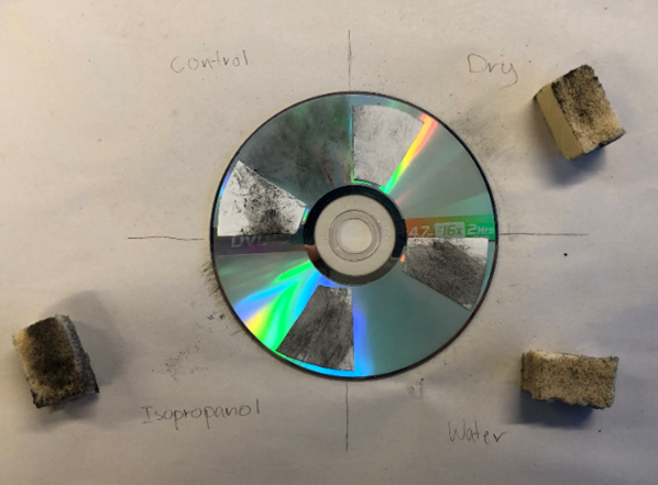 A soot-covered disc has four sections labeled 