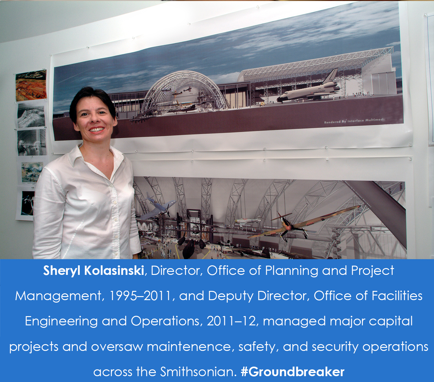 A woman stands in front of renderings of the Udvar-Hazy Center that are hanging on the wall.