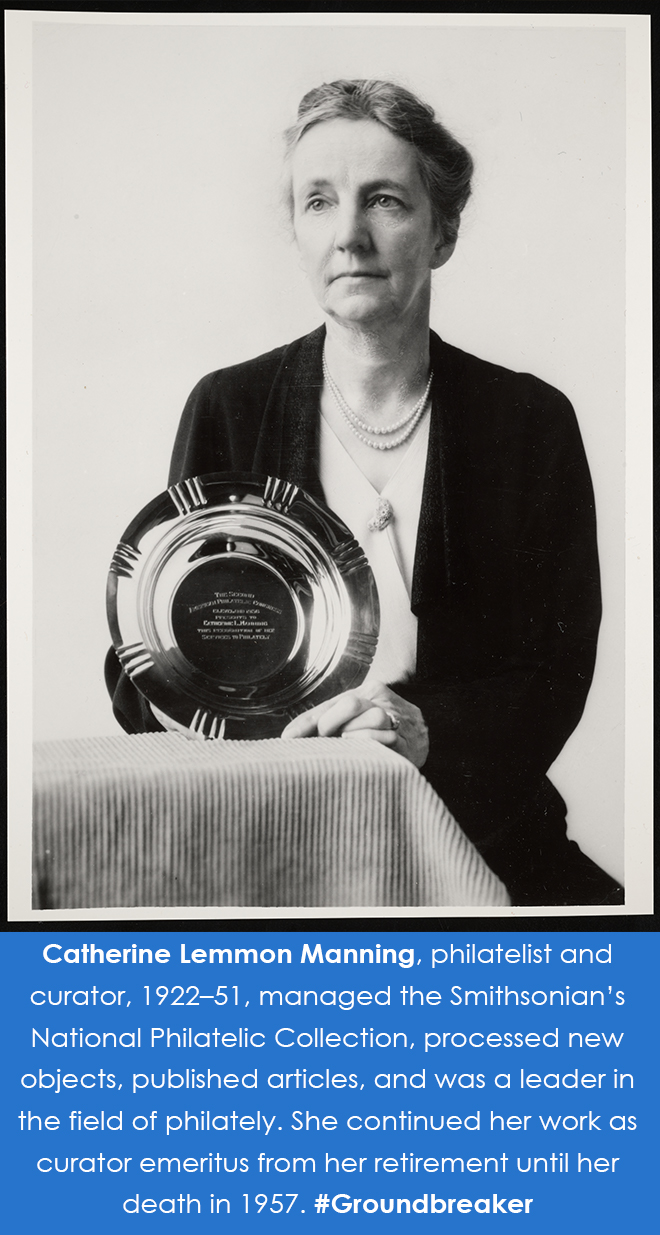 Photograph of Manning holding up an award in the shape of a round dish. 