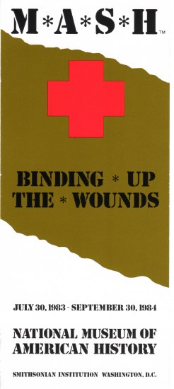 Front cover of an exhibition pamphlet. It has a brown-ish streak down the middle and a red cross at 