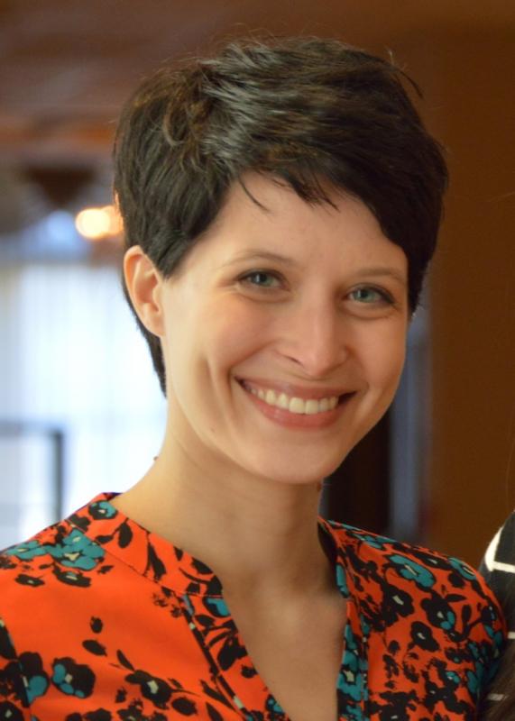 Portrait of woman smiling in colorful red shirt