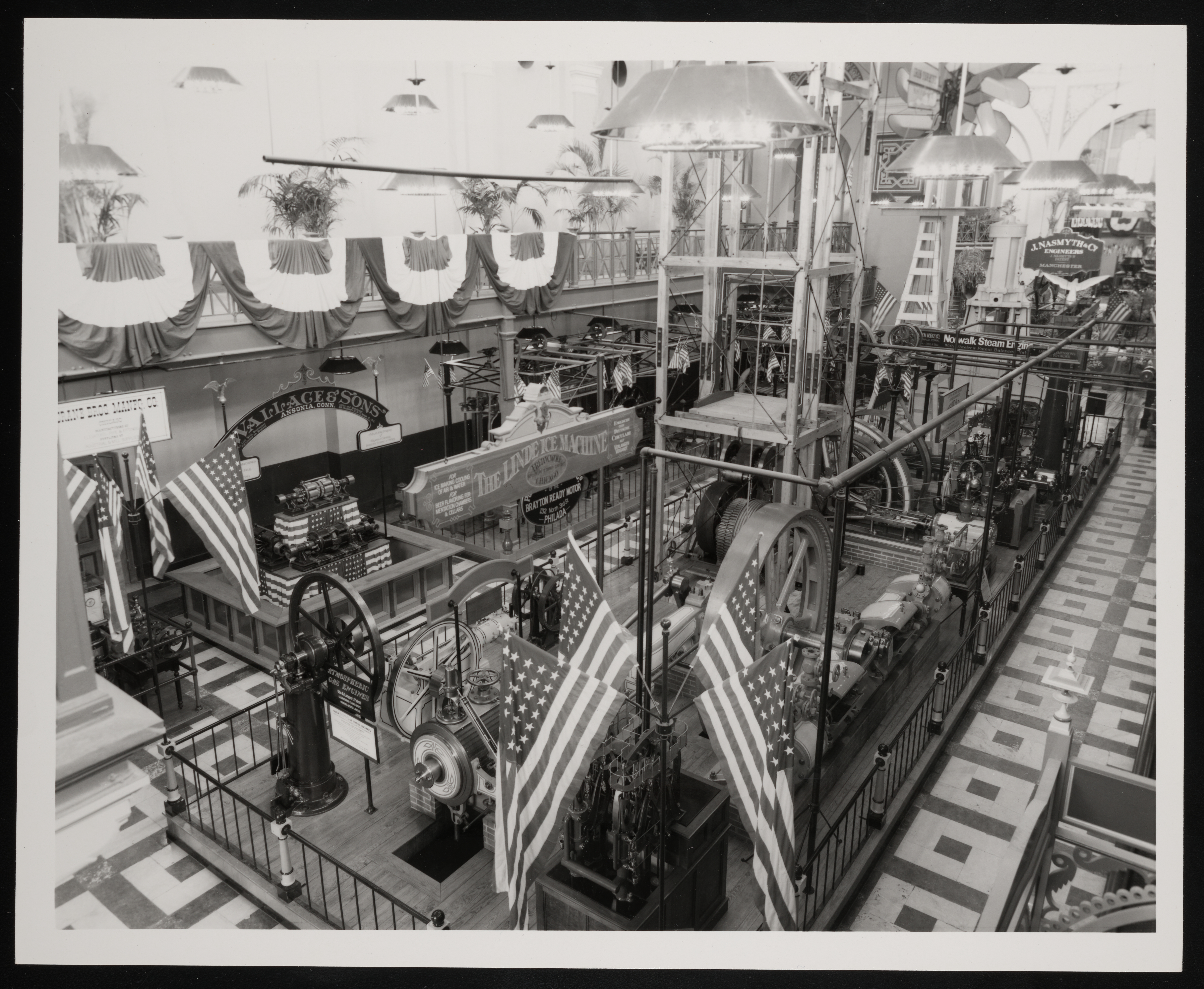 View of the exhibit from the balcony level. American flags and other patriotic decorations are visible everywhere. 