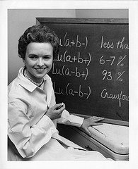 Mary N. Crawford, shown sitting next to blackboard, Smithsonian Institution Archives