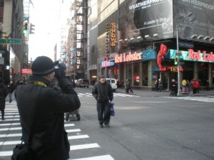 Photographer taking picture of Obama Billboard in Times Square, 2010, courtesy of Marvin Heiferman.