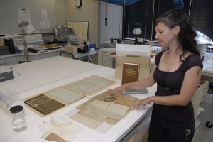 Smithsonian Institution Archives' Paper Conservator, Nora Lockshin, with the Diary of Adam Francis P