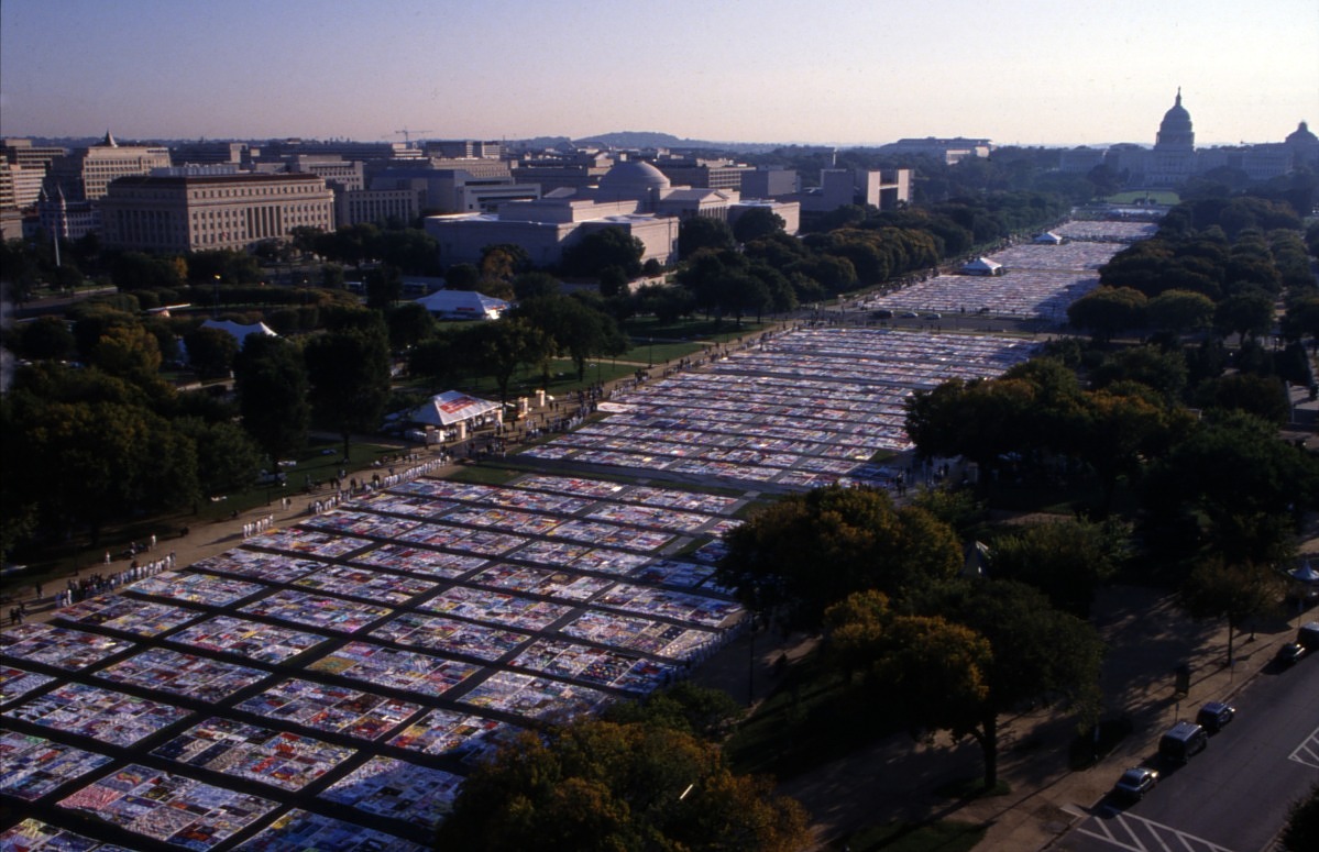 Aerial photograph of the National Mall with the NAMES Project AIDS Memorial Quilt covering the four blocks west of the U.S. Capitol Building.