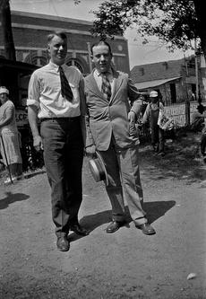 College student William Silverman (at right), standing with his former high scho