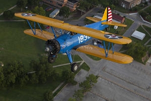 The PT-13 D Stearman flying over Tuskegee Alabama, July 30, 2011, by Michael Barnes.