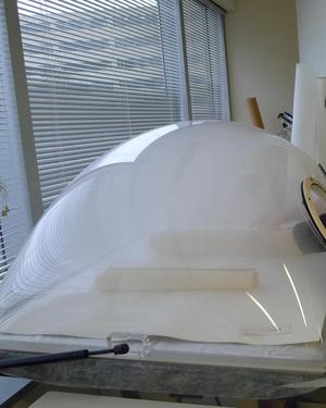 Documents relaxing in a humidification chamber. You might be able to make out Nora Lockshin's hands