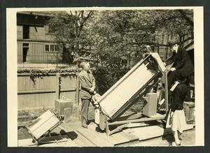 Charles G. Abbot with solar oven and solar boiler, c. 1942, black-and-white photo, SIA, Accession 12