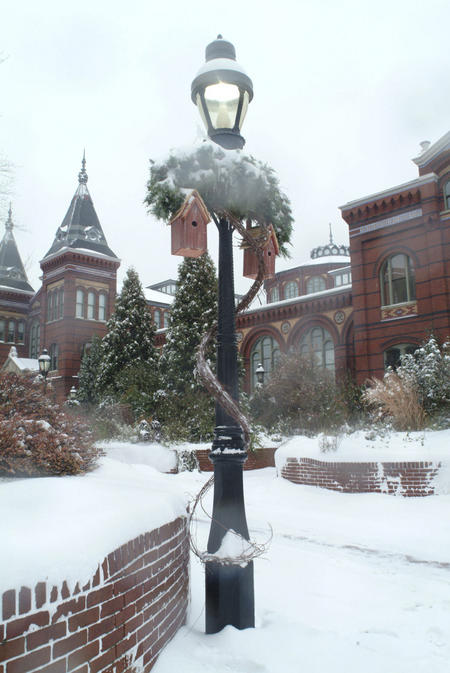 Lamp post outside the Arts and Industries Building after a snowfall.