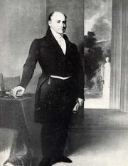 Full body portrait of John Quincy Adams, standing in a dark suit with rolled paper in one hand and h