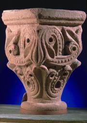 Photograph of sandstone carved capital with swirling patterns