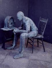 Statue by George Segal of a citizen listening to one of President Roosevelt's fireside chats.