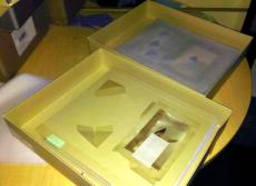 (top) A box being prepared for digitized. Notice the sheet of tissue placed over the top of the draw
