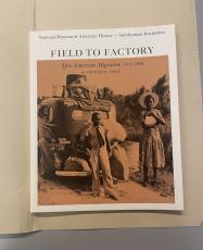 The Field to Factory: Afro-American Migration 1914-1940 exhibition catalogue display on top of an ar