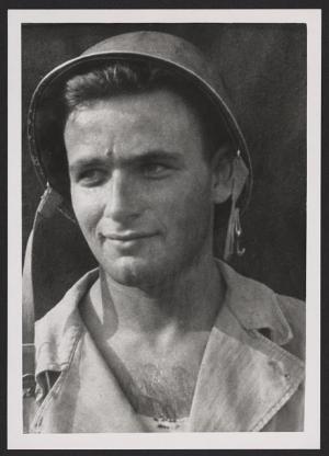 Black and white photo of man wearing military style helmet