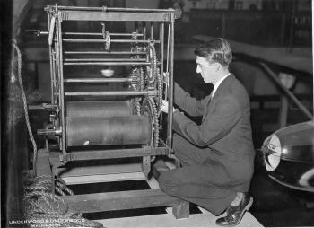 Frank A. Taylor working on a press shortly after his arrival at the National Museum in 1922, by Unde