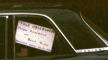 Sign for the Yale Observatory Eclipse Expedition and Beach Party, 1970, in a car window. 