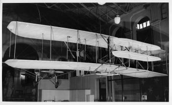 The original Wright Flyer hanging from the ceiling in the Arts and Industries Building, 1948.