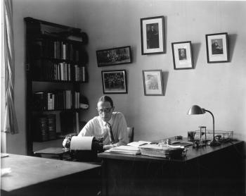 Science Service astronomy editor James Stokley seated at his desk in Washington, D.C. 