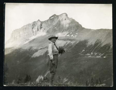 Mary Vaux Walcott, holding wild flowers in Canadian Rockies, c. 1920s, Record Unit 95 - Photograph Collection, 1850s - , Smithsonian Institution Archives, neg. no. 2004-22992.