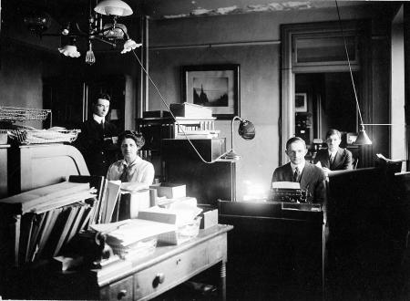 Helen Munroe, Chairman of the Smithsonian Red Cross auxiliary at her desk in the Publications Room.