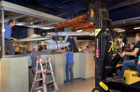 The Star Trek starship Enterprise Studio Model being removed from the lower level of the National Ai