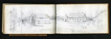 Color photograph of a handheld field notebook opened, and displaying a sketch of a rural landscape.