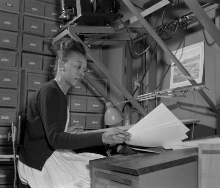 Scanning technique demonstrated by Mattie Woodford, Powell Group film scanner, taken April 1961. Nat