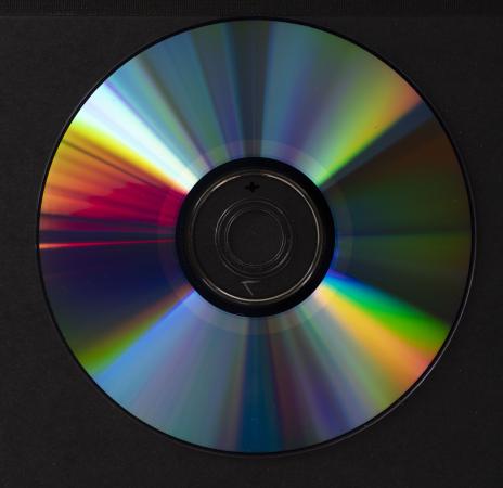 The center portion of the reverse side of a disc has a ring of color that is lighter from the rest o