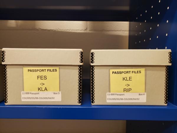 Two boxes labeled passport files. 