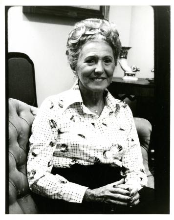  Black-and-white portrait of Rosenberg seated in a chair. 